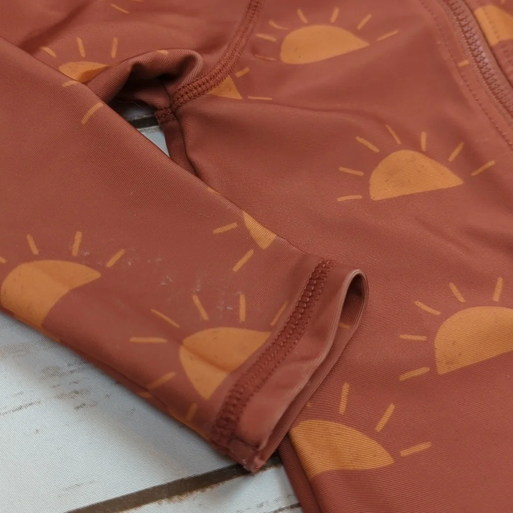 Kids Rust Orange Sun Print One-Piece Swimsuit - Long Sleeve